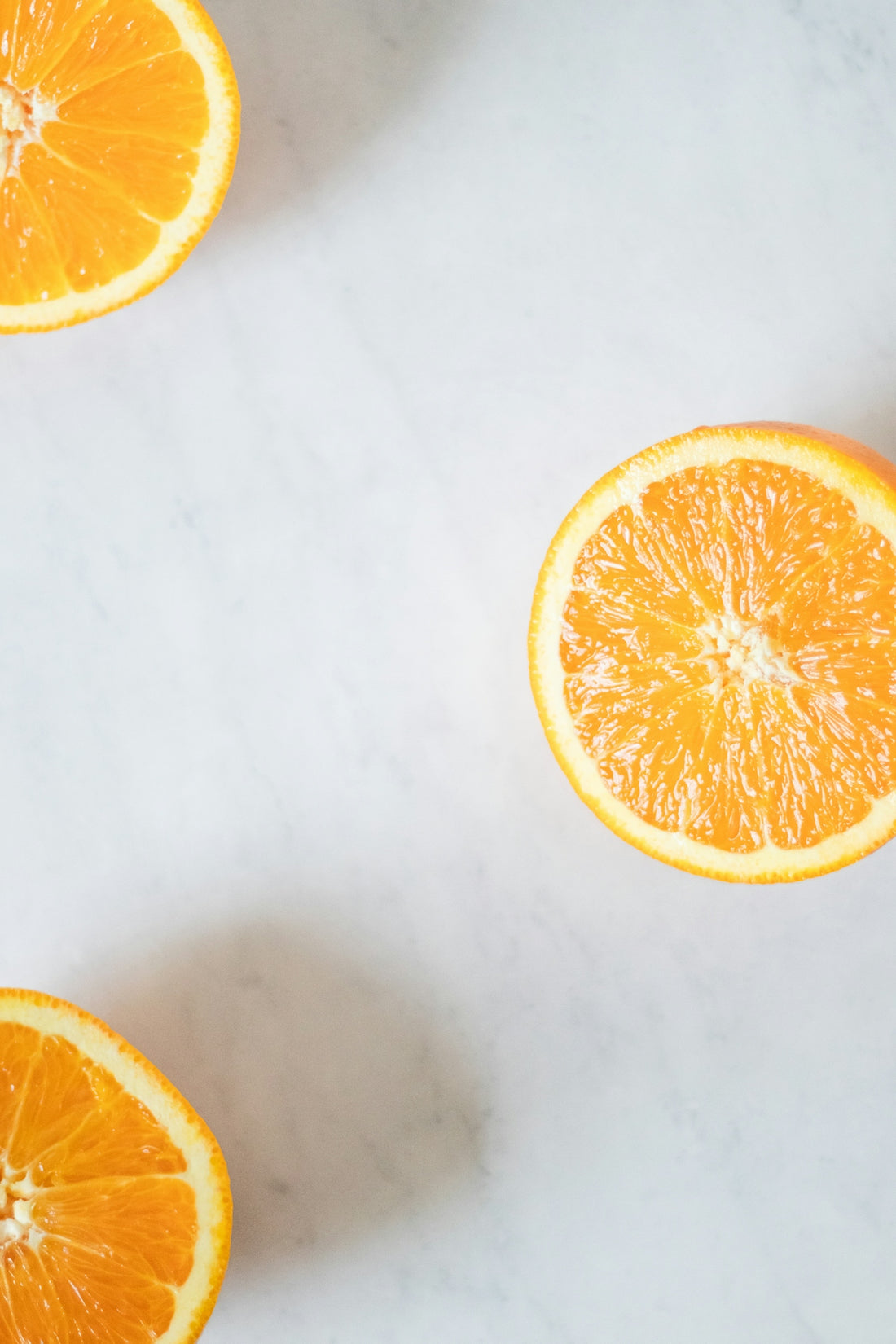 A group of oranges sitting on top of a white counter