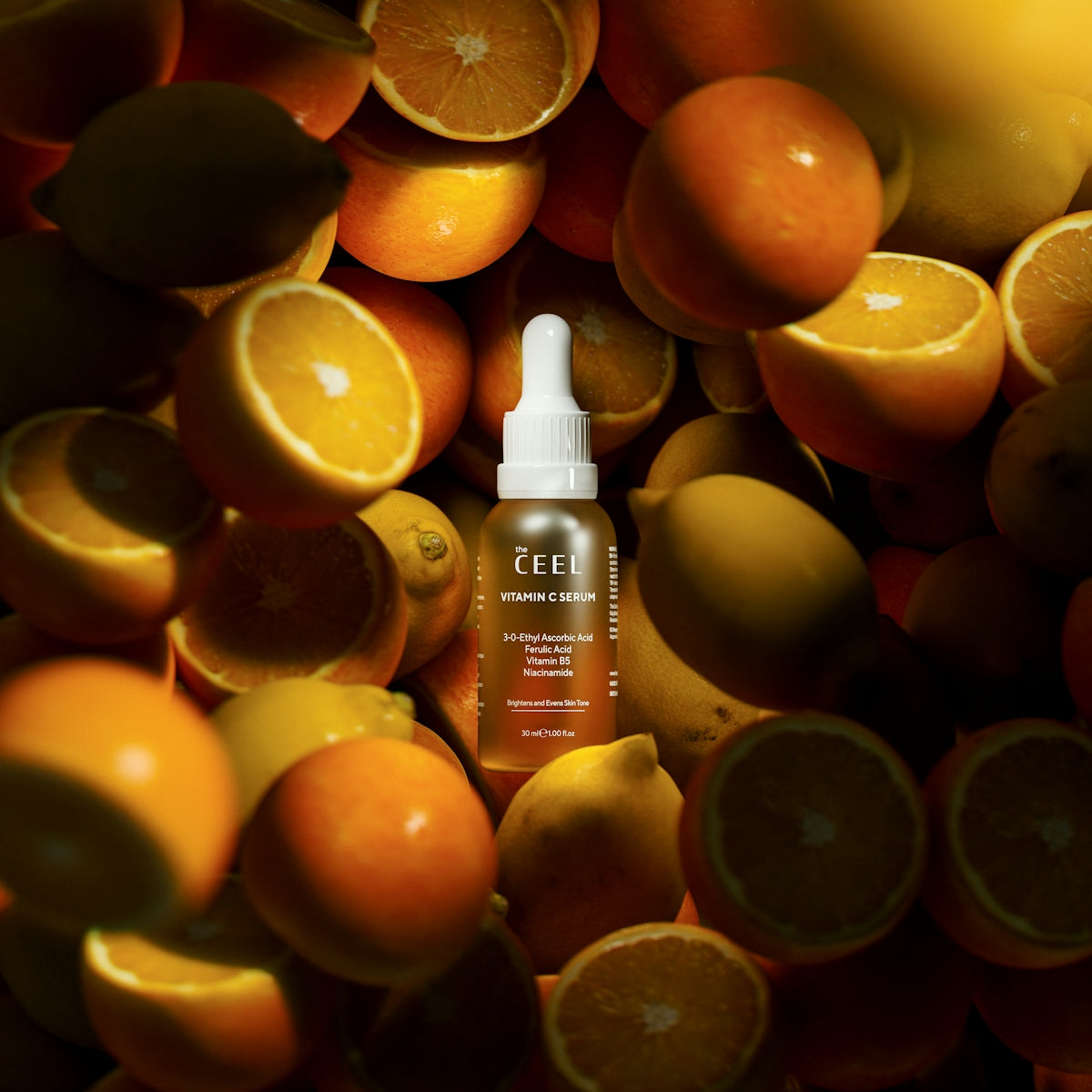 Ceel vitamin c serum bottle among fresh citrus fruits